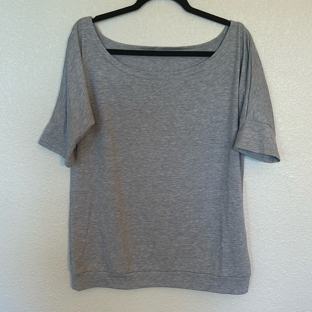 Women’s gray odd shoulder top size medium.